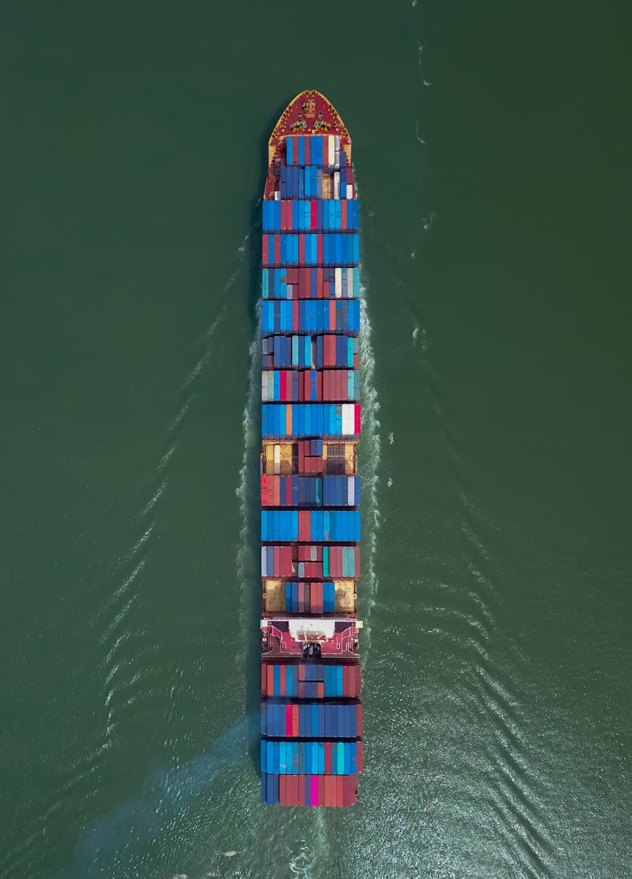 Aerial view of a loaded container ship at sea